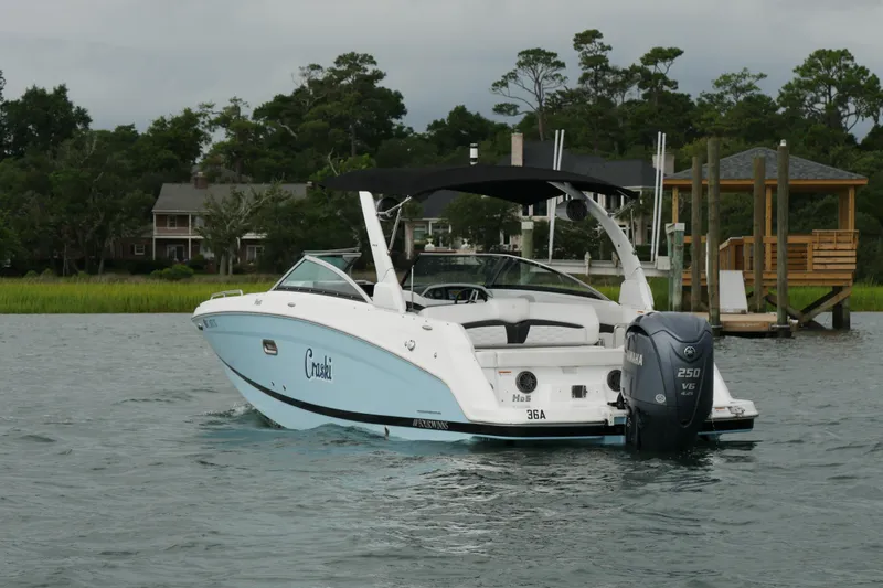 Slide: The Image of 2022 Four Winns HD5 OB boat on water, featuring Yamaha 250 V6 engine. - 10