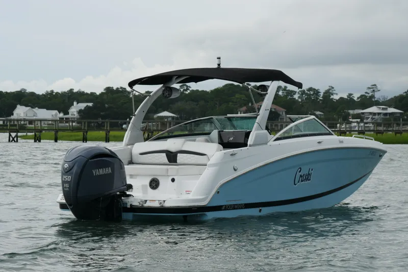 Slide: The Image of 2022 Four Winns HD5 OB boat with Yamaha engine on a calm waterway. - 6