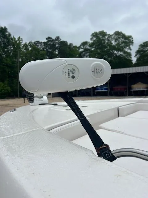 Slide: The Image of 2021 Robalo 226 Cayman boat detail with white accessory and overcast sky. - 5