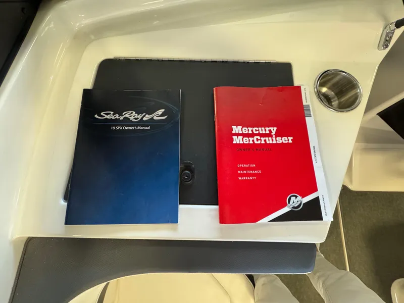 Slide: The Image of Owner manuals for Sea Ray 190 Sport and Mercury MerCruiser on a boat surface. - 11