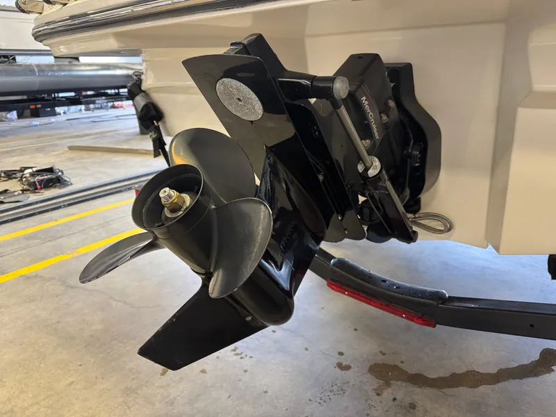 Slide: The Image of Close-up of a 2015 Sea Ray 190 Sport boat propeller and engine in a garage. - 13