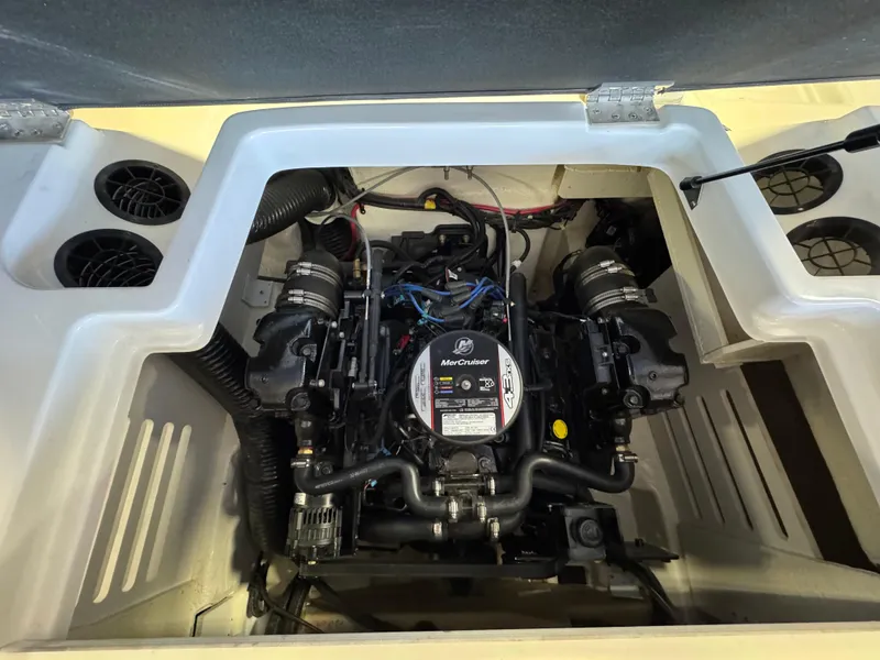 Slide: The Image of Engine compartment of a 2015 Sea Ray 190 Sport boat, featuring a MerCruiser engine. - 14