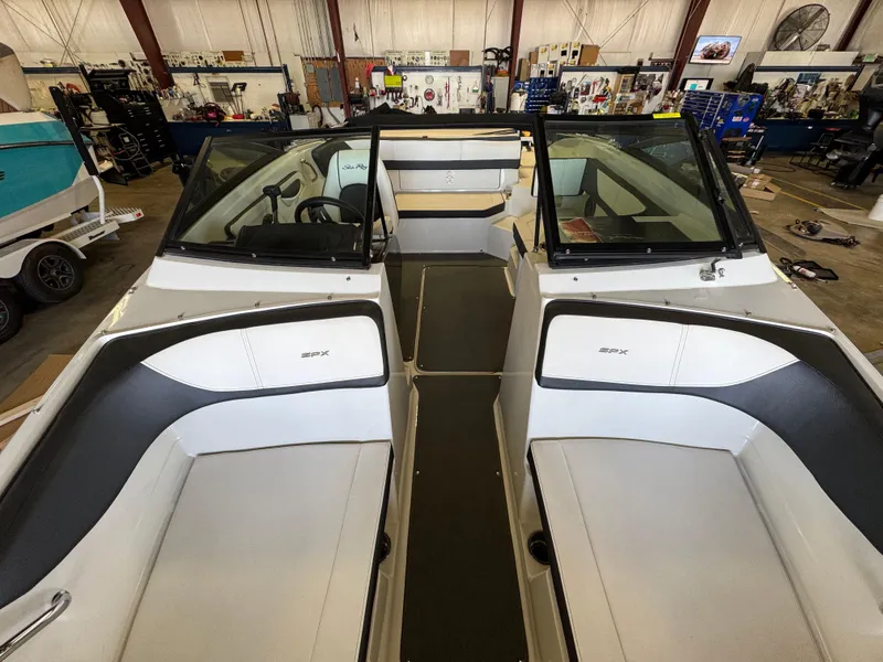 Slide: The Image of 2015 Sea Ray 190 Sport boat interior in a workshop setting. - 8