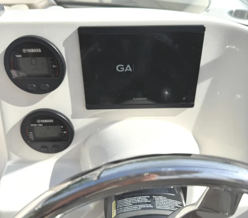 Slide: The Image of Dashboard of 2022 Key West 203 DFS boat with Garmin display and Yamaha gauges. - 11