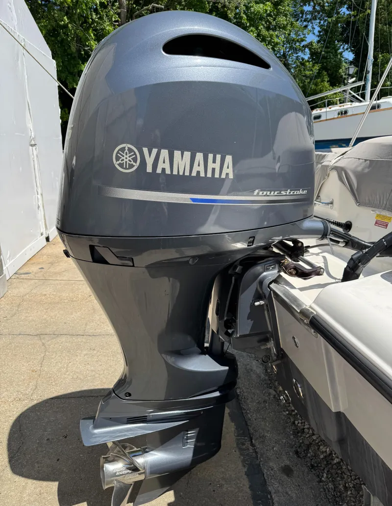 Slide: The Image of Yamaha outboard motor on 2022 Key West 203 DFS boat, docked outdoors. - 16