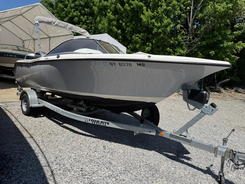 Slide: The Image of 2022 Key West 203 DFS boat on trailer, parked outdoors. - 3