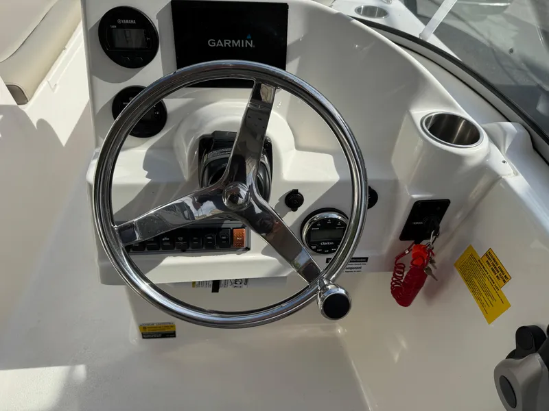 Slide: The Image of Steering console of 2022 Key West 203 DFS boat with Garmin display and controls. - 7