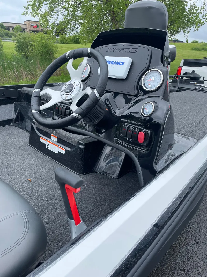 Slide: The Image of 2025 Nitro Z17 boat dashboard with steering wheel and control panel. - 4