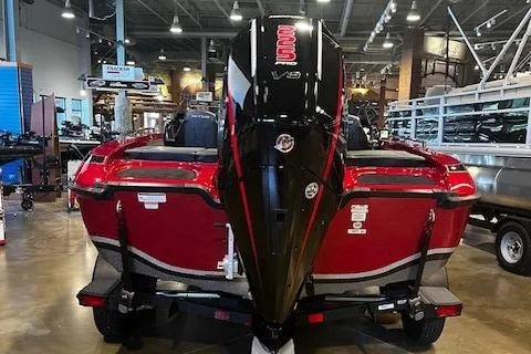 Slide: The Image of 2025 Nitro ZV19 Sport boat in showroom, rear view with powerful engine. - 2