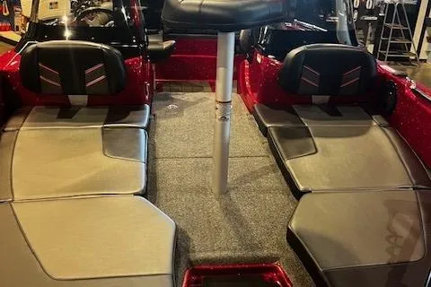 Slide: The Image of 2025 Nitro ZV19 Sport boat interior with cushioned seating and carpeted flooring. - 7