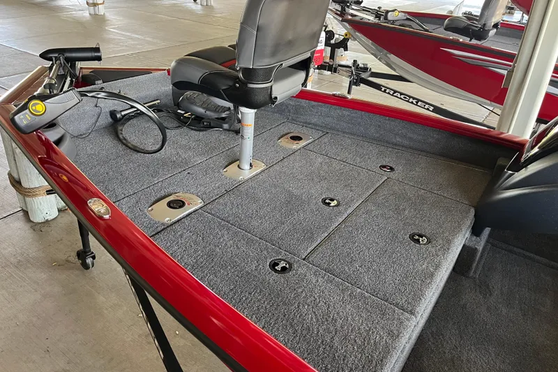 Slide: The Image of 2025 Tracker Pro Team 175 Crappie Edition boat interior with seating and controls. - 2
