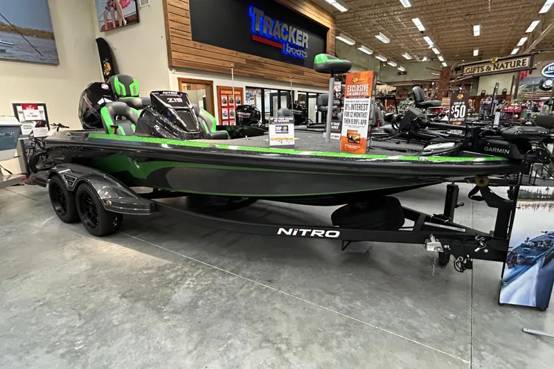 The Image of 2025 Nitro Z19 boat displayed in showroom with promotional signs and accessories. - 0