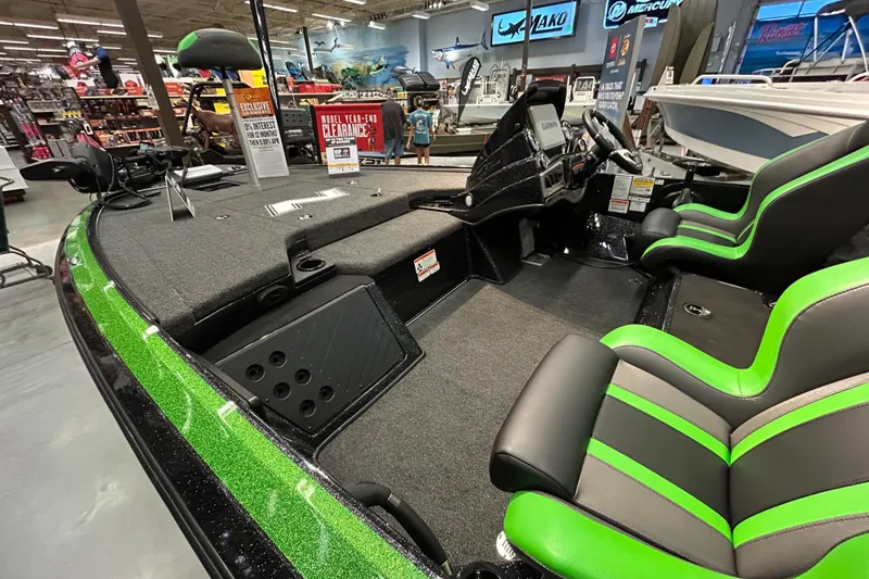 Slide: The Image of 2025 Nitro Z19 boat interior with green accents, displayed in a showroom. - 4