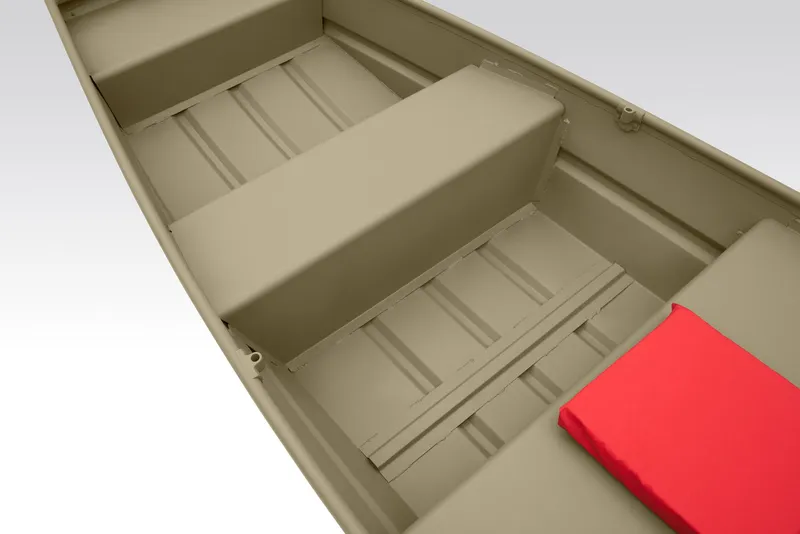 Slide: The Image of 2025 Tracker Grizzly 10 Jon boat, beige interior, parked on concrete surface. - 6