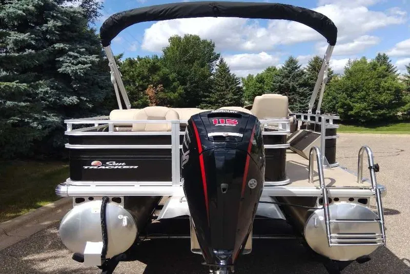 Slide: The Image of 2025 Sun Tracker SportFish 22 DLX pontoon boat with powerful outboard motor. - 5