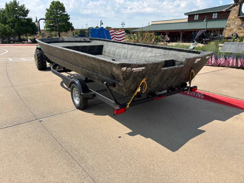 Slide: The Image of 2025 Tracker GRIZZLY 2072 Utility boat with spacious interior and camouflage design. - 2