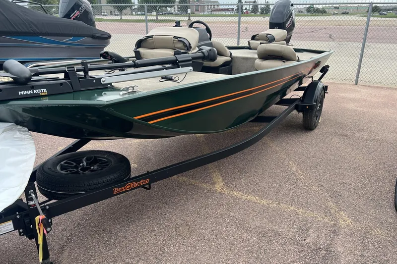 The Image of 2025 Tracker Bass Tracker Classic Limited boat on trailer, parked outdoors. - 0
