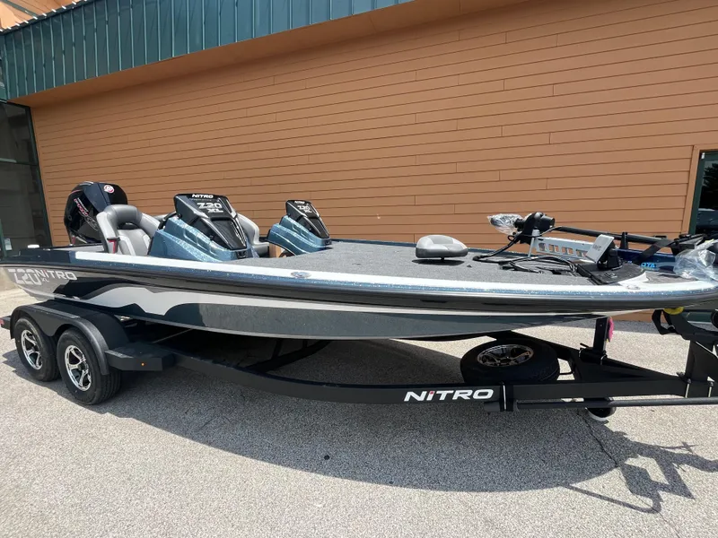 Slide: The Image of 2025 Nitro Z20 XL Pro boat on trailer, parked outside a building. - 1