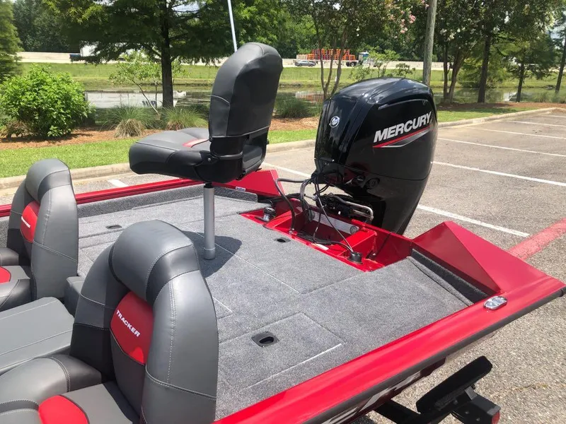 Slide: The Image of 2025 Tracker Pro Team 175 boat with Mercury engine, featuring gray and red seating. - 11