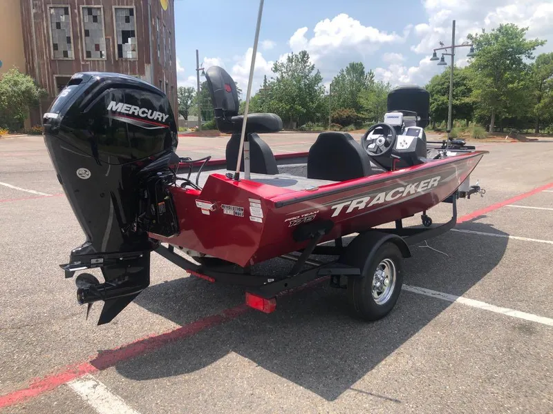 Slide: The Image of 2025 Tracker Pro Team 175 boat with Mercury engine in parking lot. - 3
