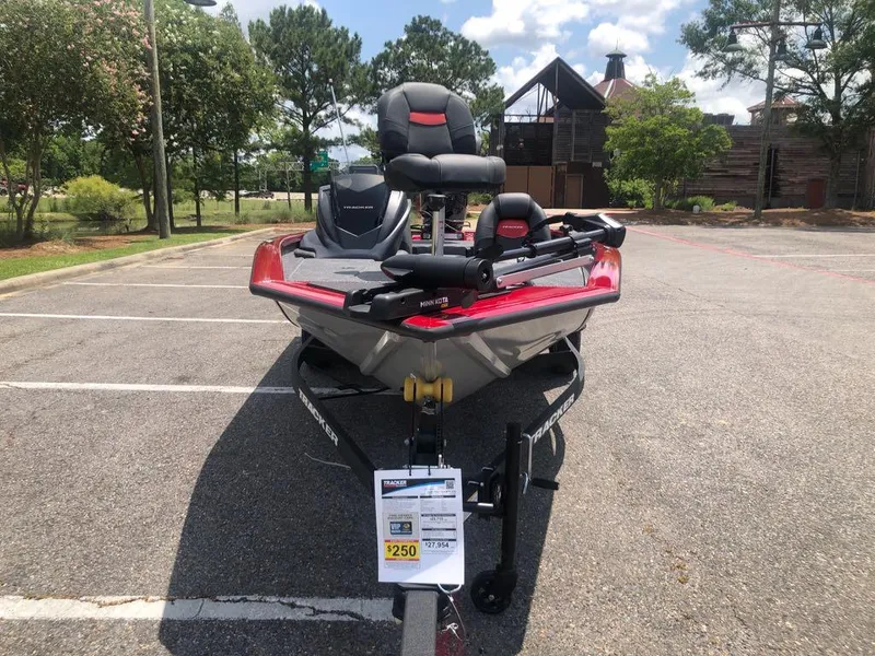 Slide: The Image of 2025 Tracker Pro Team 175 boat in parking lot, front view, sunny day. - 6