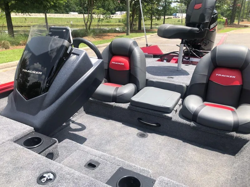 Slide: The Image of 2025 Tracker Pro Team 175 boat interior with seating and steering console. - 9