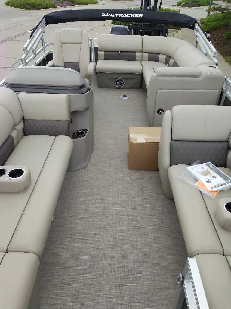 Slide: The Image of 2025 Sun Tracker Party Barge 20 DLX with spacious seating and modern interior design. - 3