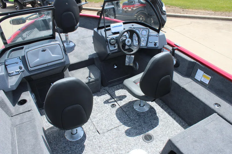 Slide: The Image of 2025 Tracker Pro Guide V-175 Combo boat interior with steering console and seating. - 10