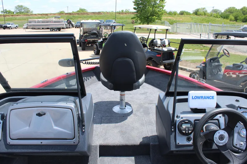 Slide: The Image of 2025 Tracker Pro Guide V-175 Combo boat interior with steering wheel and Lowrance equipment. - 14
