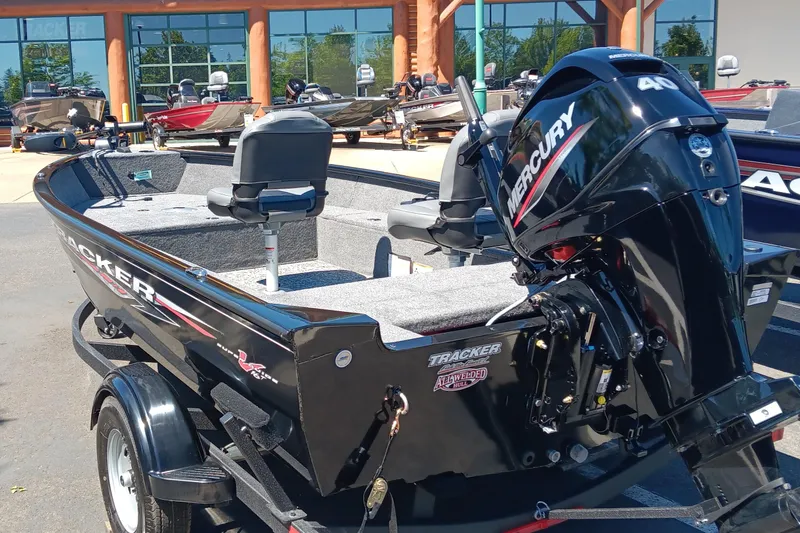 Slide: The Image of 2025 Tracker Super Guide V-16 T boat with Mercury engine displayed outdoors. - 3