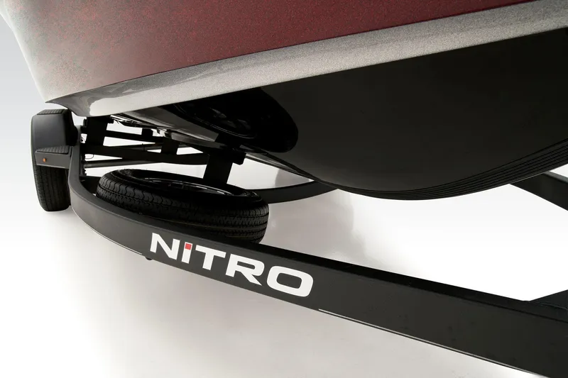 Slide: The Image of 2025 Nitro ZV19 Pro boat interior with seating and steering wheel in showroom. - 5