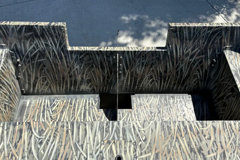 Slide: The Image of 2025 Tracker Grizzly 2072 Utility boat interior with camouflage pattern design. - 20