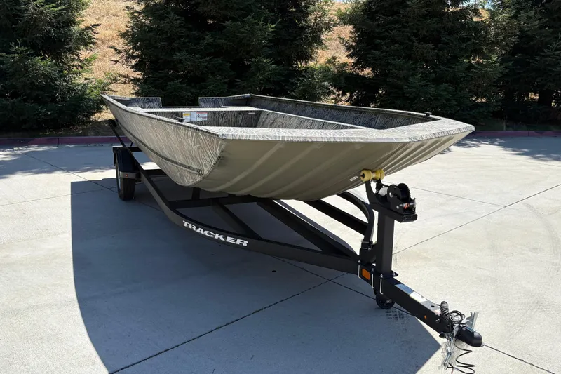 Slide: The Image of 2025 Tracker Grizzly 2072 Utility boat on trailer, parked outdoors. - 15