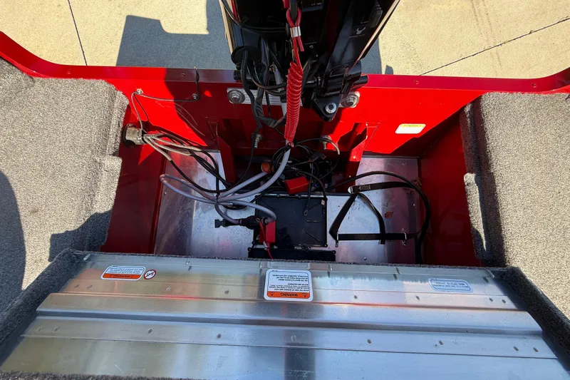 Slide: The Image of Interior view of a 2025 Tracker Super Guide V-16 T boat, showcasing wiring and components. - 26