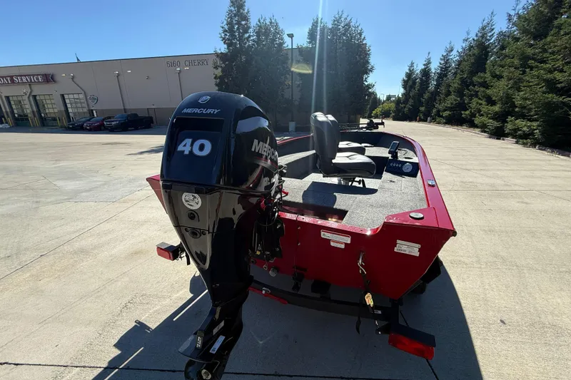 Slide: The Image of 2025 Tracker Super Guide V-16 T boat with Mercury 40 engine, parked outdoors. - 5