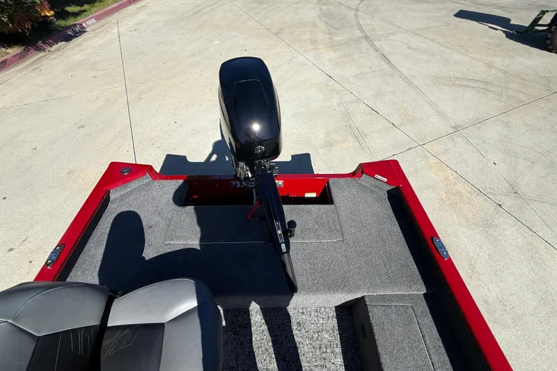 Slide: The Image of 2025 Tracker Super Guide V-16 T boat with motor, red and gray interior. - 12