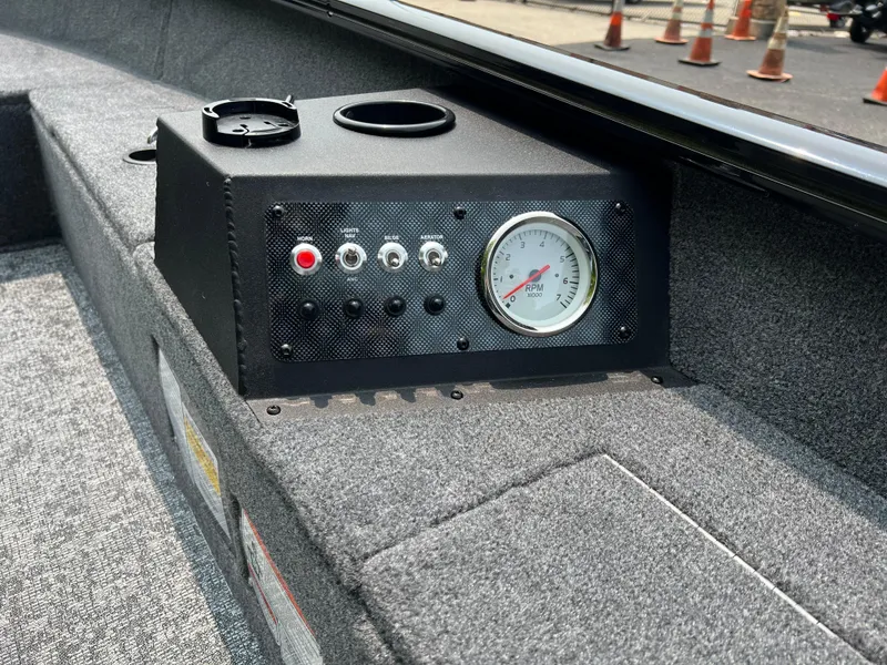 Slide: The Image of 2025 Tracker Super Guide V-16 T boat console with gauge and controls. - 6