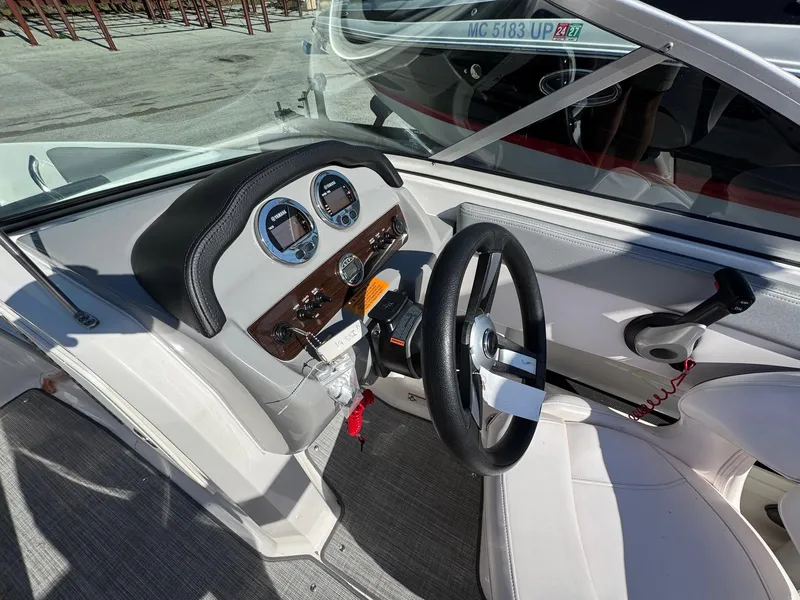 Slide: The Image of 2020 Chaparral 19 SSi OB boat dashboard with steering wheel and gauges. - 11