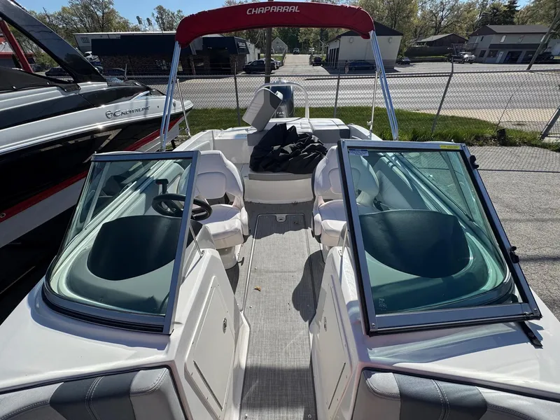 Slide: The Image of 2020 Chaparral 19 SSi OB boat with open bow seating and red canopy. - 15