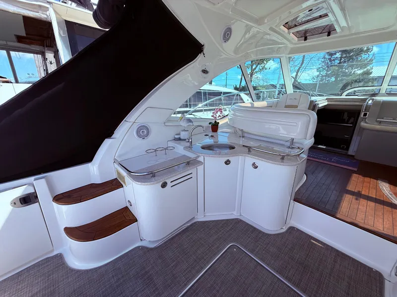 Slide: The Image of 2009 Sea Ray 48 Sundancer interior with elegant seating and modern amenities. - 10