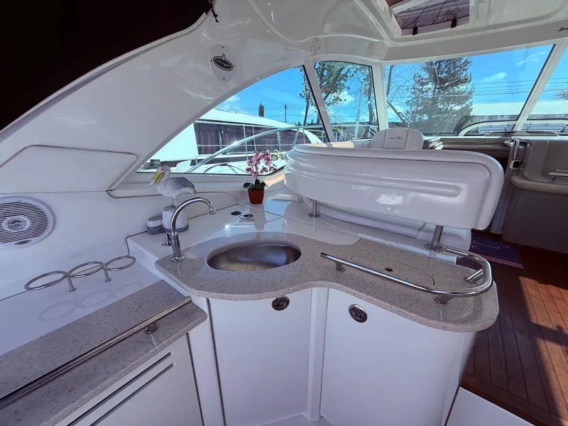Slide: The Image of Luxurious 2009 Sea Ray 48 Sundancer yacht interior with sleek kitchenette and modern amenities. - 11