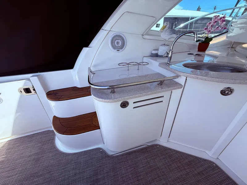 Slide: The Image of 2009 Sea Ray 48 Sundancer yacht interior with kitchenette and steps. - 12