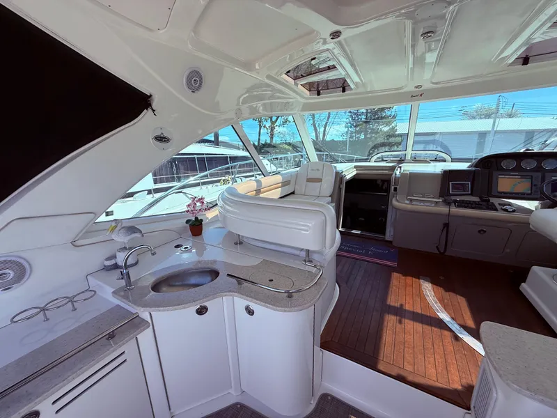 Slide: The Image of Luxurious 2009 Sea Ray 48 Sundancer yacht interior with modern amenities and sleek design. - 14
