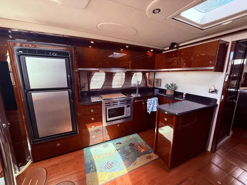 Slide: The Image of Luxurious kitchen interior of 2009 Sea Ray 48 Sundancer yacht with modern appliances. - 26