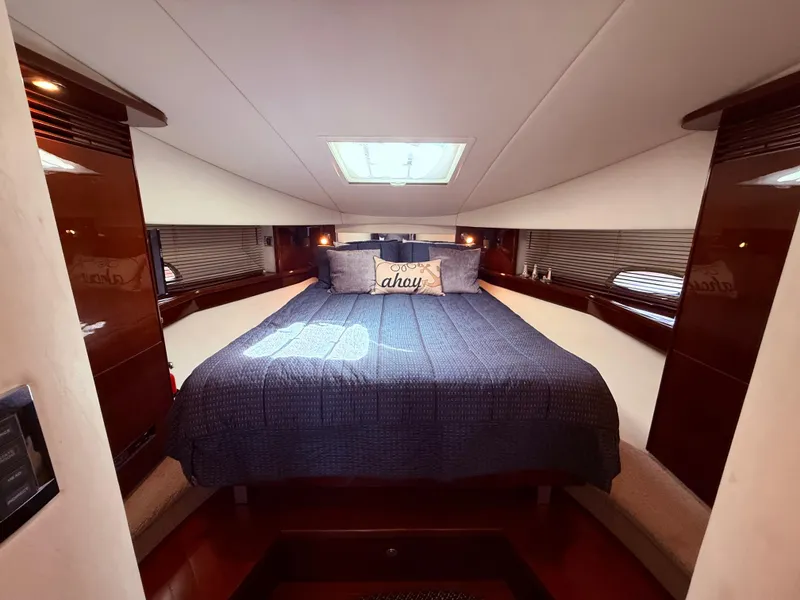 Slide: The Image of Luxurious cabin interior of 2009 Sea Ray 48 Sundancer yacht with cozy bedding. - 33