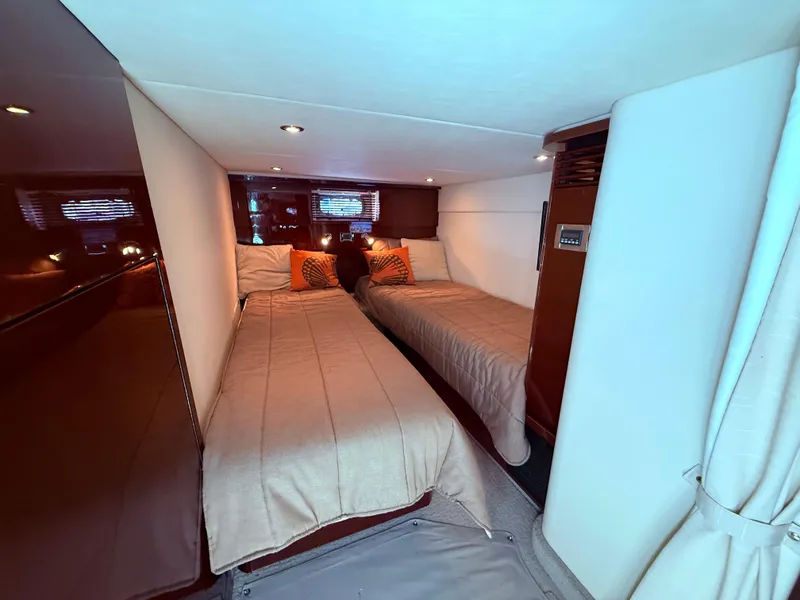 Slide: The Image of Interior cabin of 2009 Sea Ray 48 Sundancer with twin beds and cozy decor. - 40