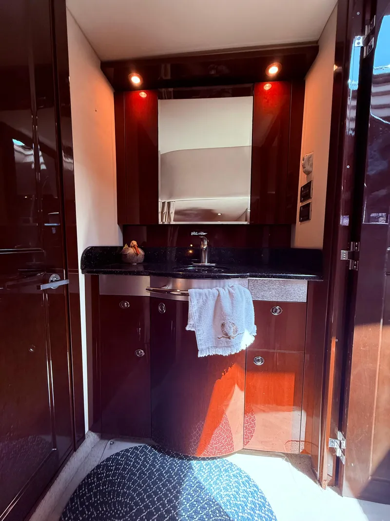 Slide: The Image of Luxurious 2009 Sea Ray 48 Sundancer yacht interior with elegant wood cabinetry and modern fixtures. - 42