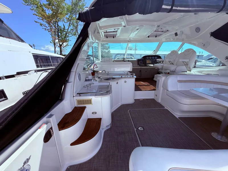 Slide: The Image of Luxurious interior of 2009 Sea Ray 48 Sundancer yacht with seating and helm. - 7