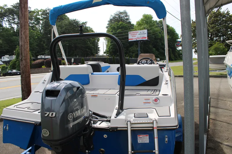 Slide: The Image of 2025 Starcraft SV 16 OB boat with Yamaha 70 engine, parked outdoors. - 3