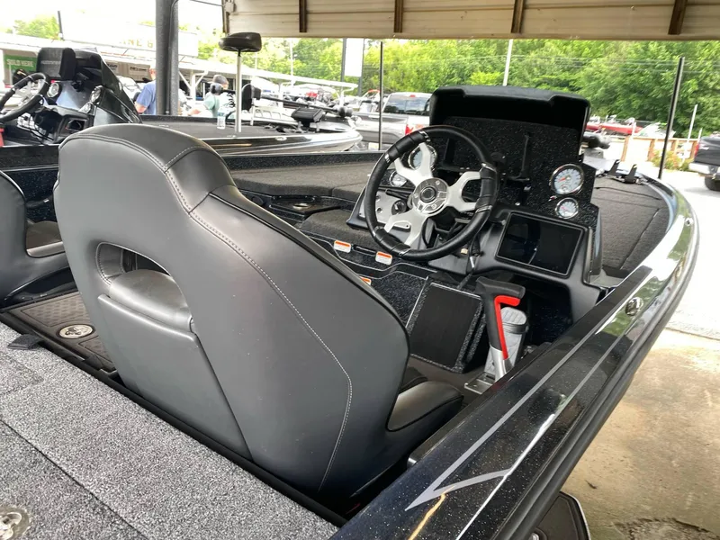 Slide: The Image of 2024 Nitro Z21 XL Pro boat interior with steering wheel and dashboard controls. - 12